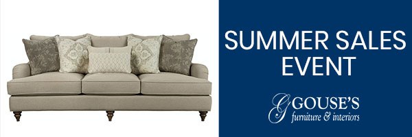 a couch with Gouse's Furniture logo and the words "Summer Sales Event" besides it.